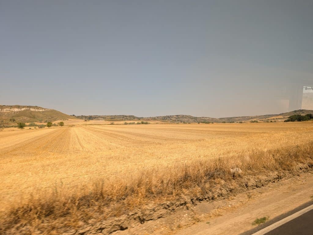 View of the open hill country from the bus to Los Santos de la Humosa.