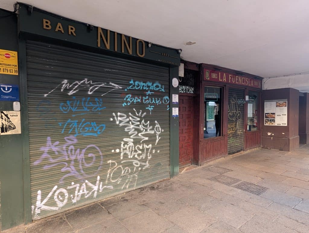 Picture of shuttered storefronts on Calle Mayor in Alcalá de Henares.